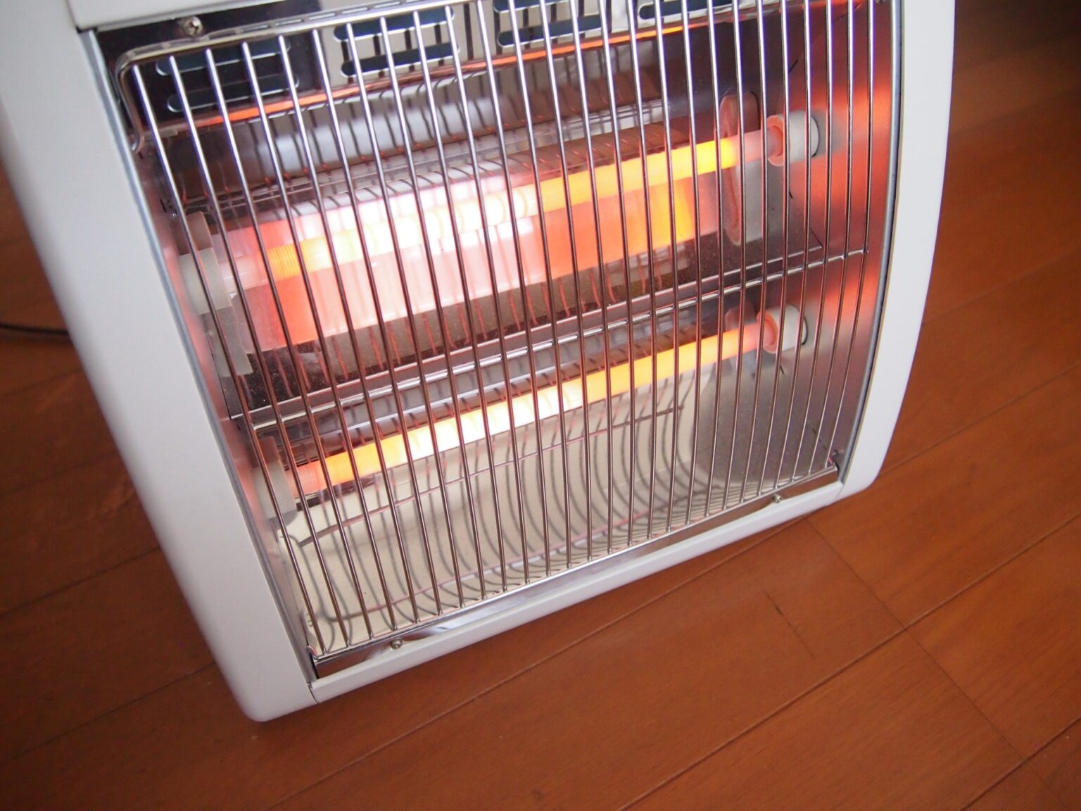 A closeup of a Halogen Heaters on a wooden floor