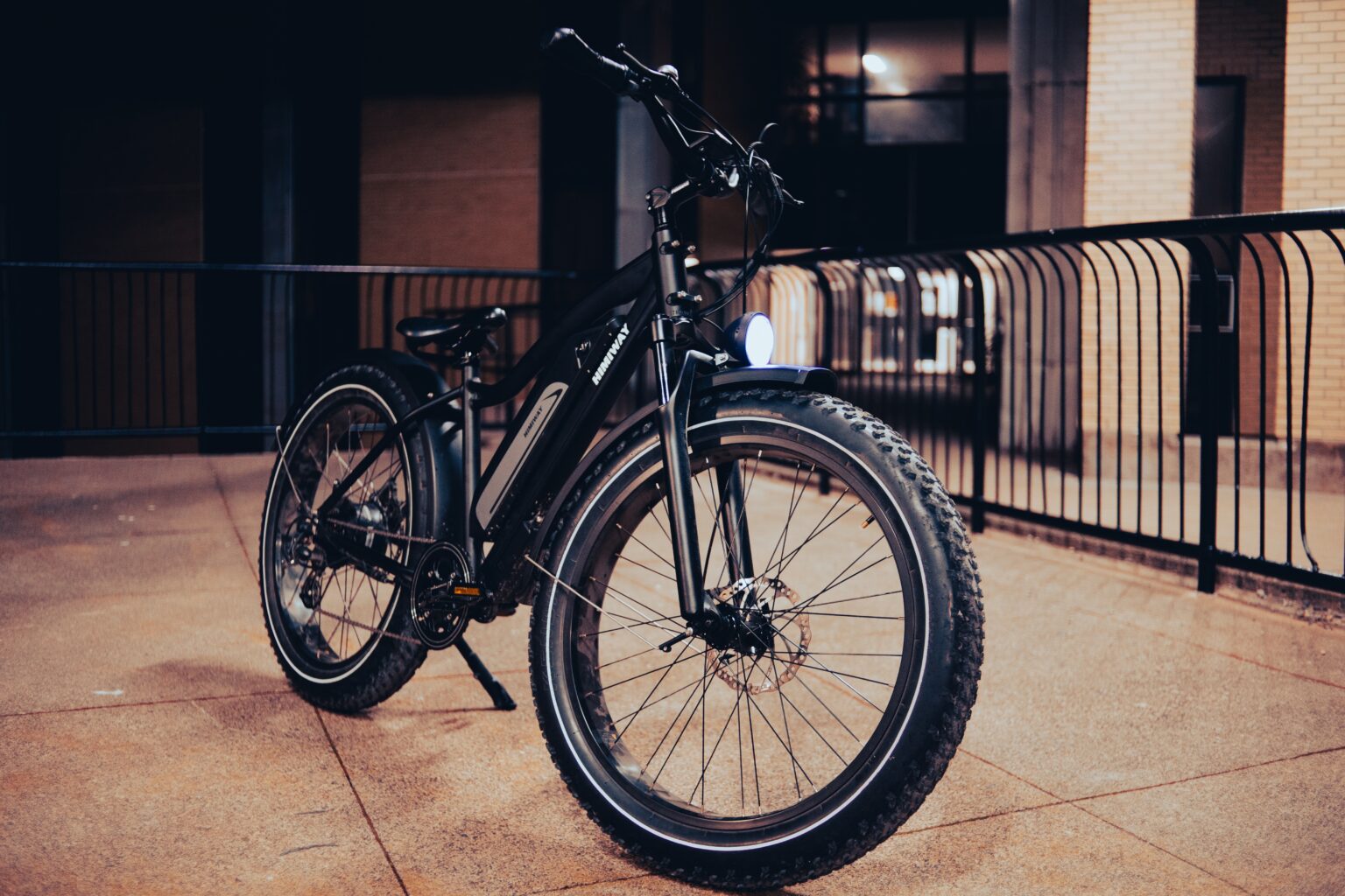 An electric bike outside of a building at night