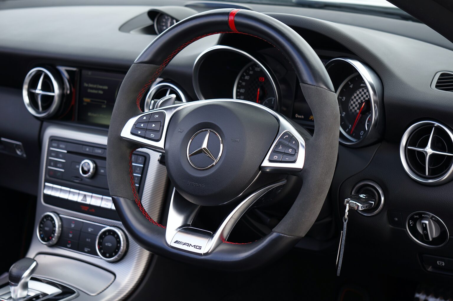 A closeup of a Mercedes steering wheel