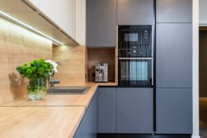 A modern kitchen with a Hot Water Dispenser on the counter