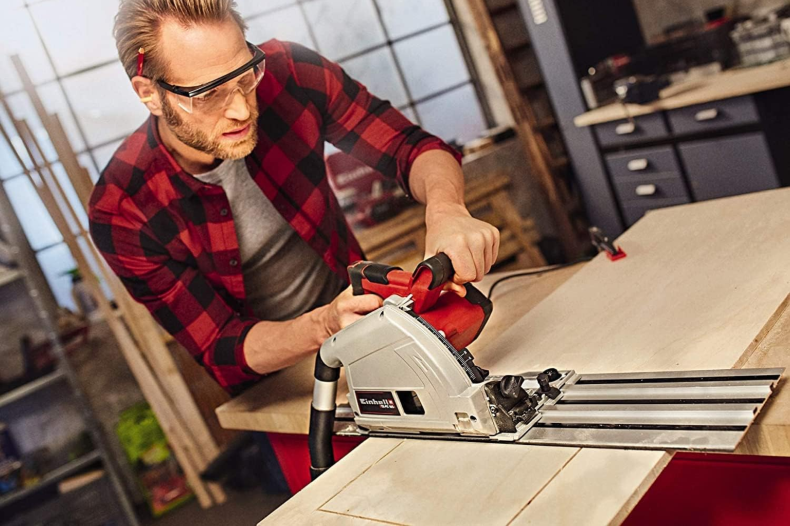 A man cutting wood with a Plunge Saw