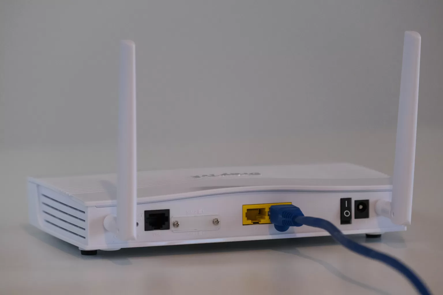 A 4G Router With External Antenna plugged in to an ethernet cable