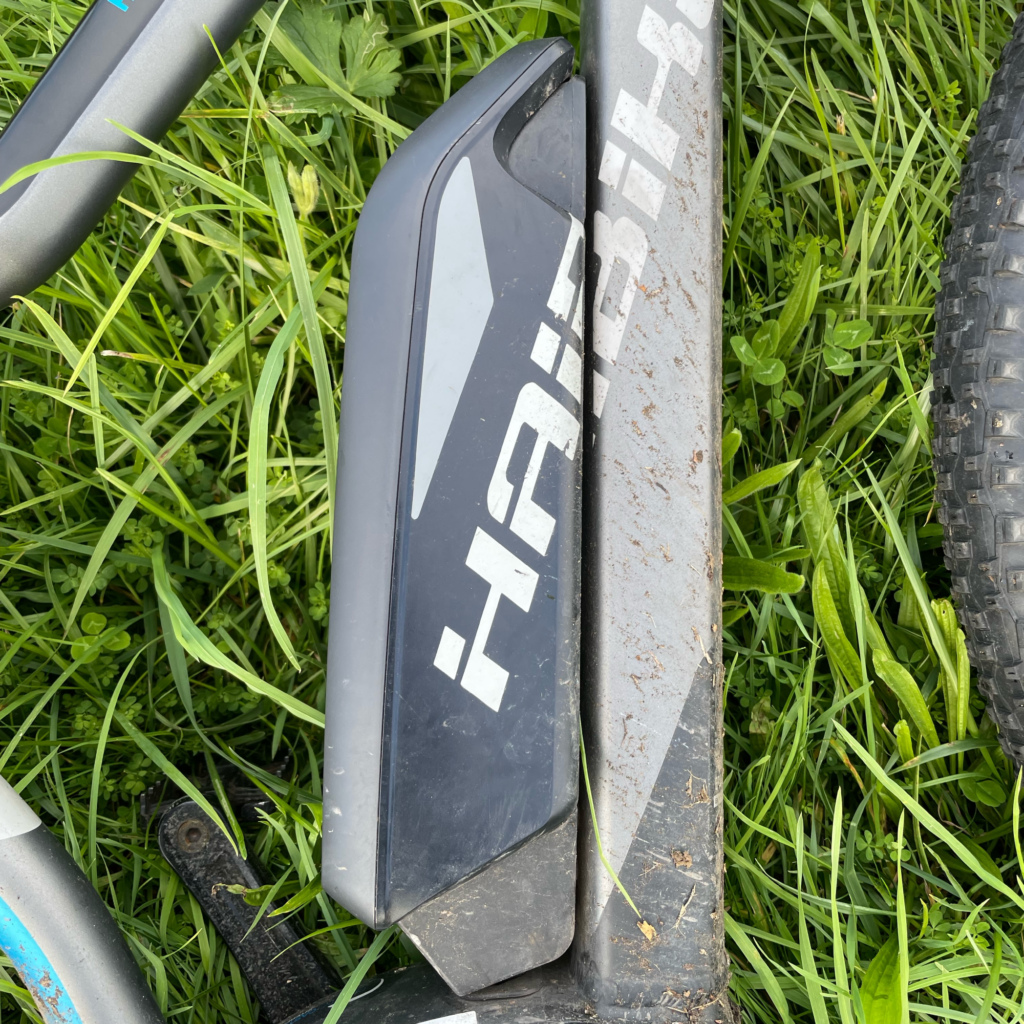 A closeup of the Haibike xDuro HardNine RC Battery with grass in the background