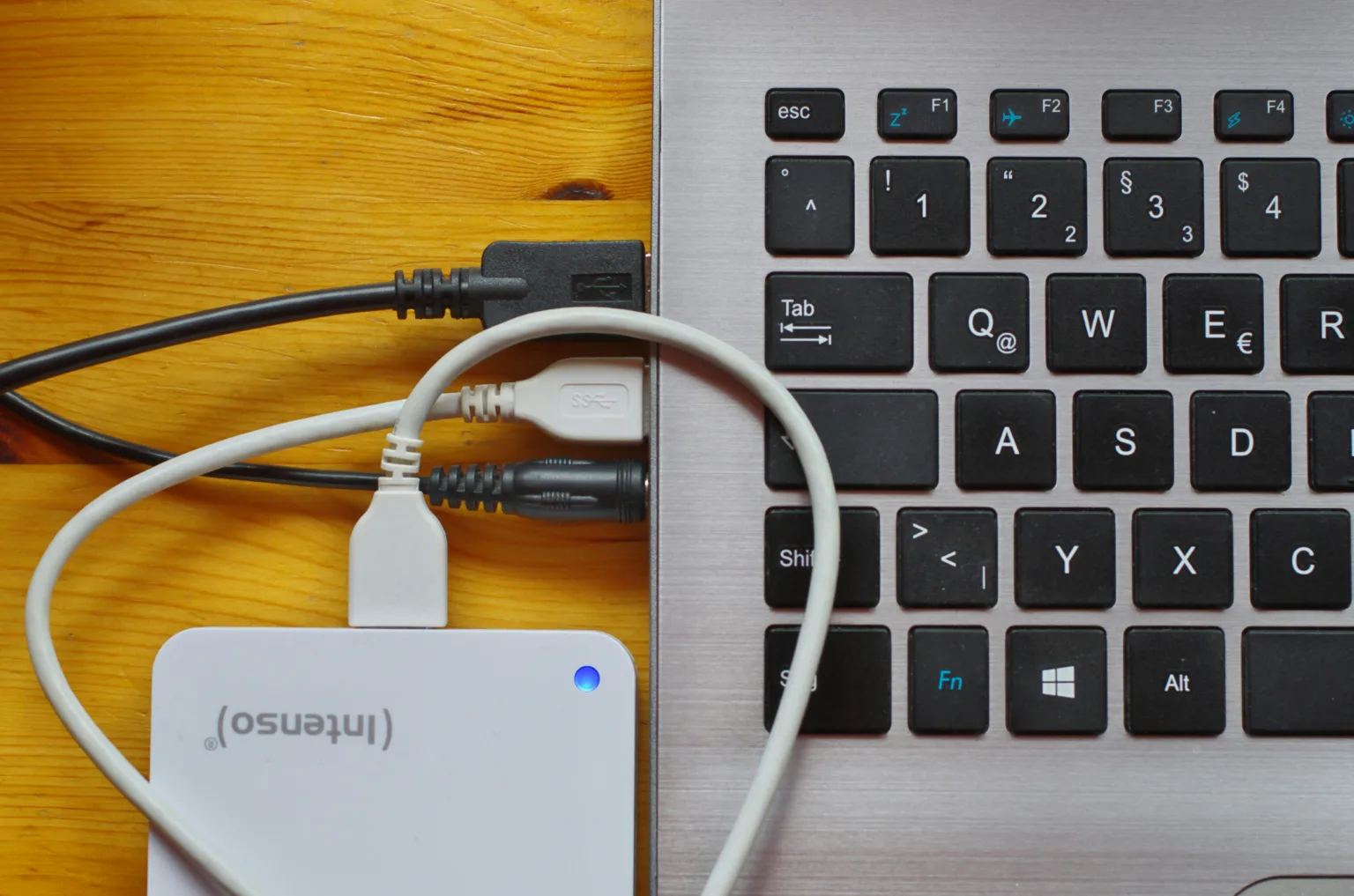 A USB Hard Drive Adapter plugged in to a laptop