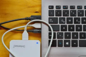 A USB Hard Drive Adapter plugged in to a laptop