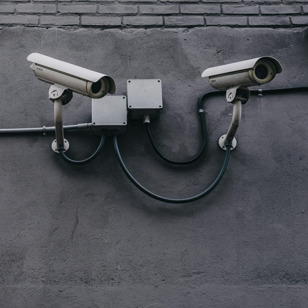 2 Outdoor Security Cameras On A Wall